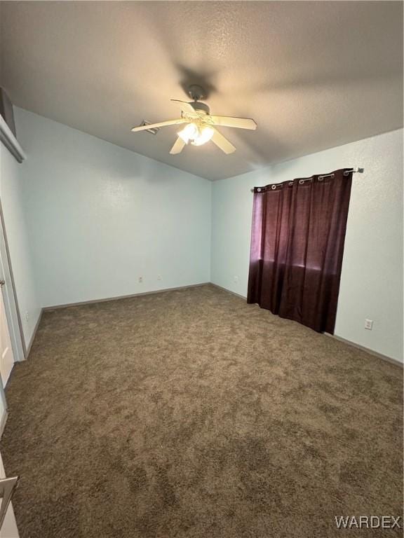 unfurnished bedroom featuring carpet flooring, ceiling fan, and a textured ceiling