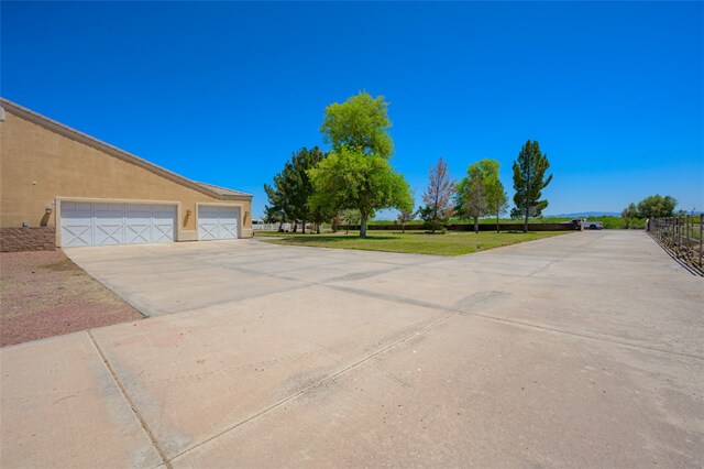 2303 E Hulet Ave, Mohave Valley, AZ 86440 - view of yard featuring a garage
