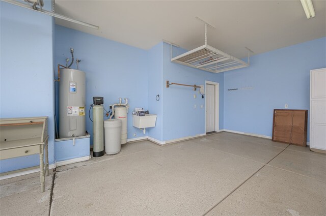 2303 E Hulet Ave, Mohave Valley, AZ 86440 - garage with water heater and a sink