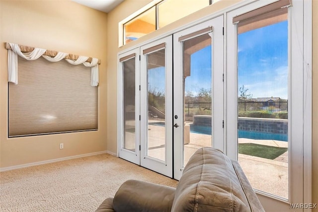 entryway with french doors and baseboards