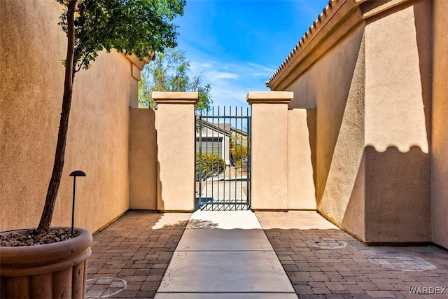 view of gate featuring fence