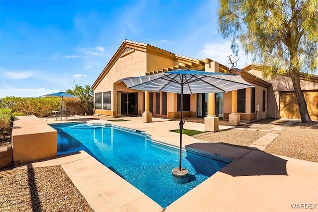 pool with fence and a patio area