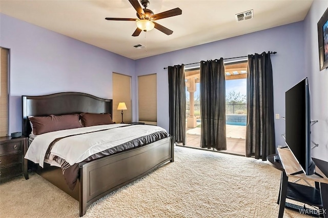 bedroom featuring visible vents, carpet floors, access to exterior, and a ceiling fan