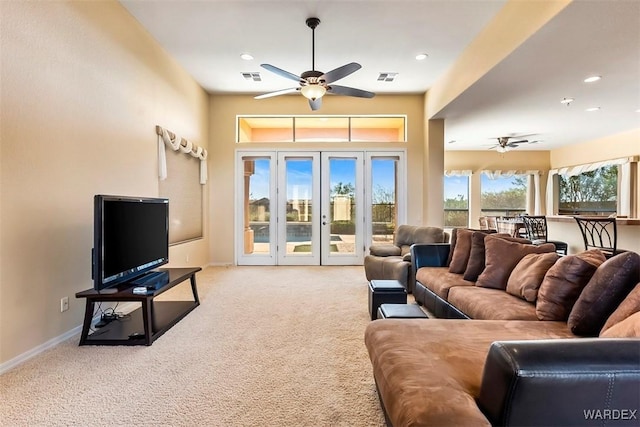 living room with visible vents, baseboards, carpet floors, french doors, and a ceiling fan