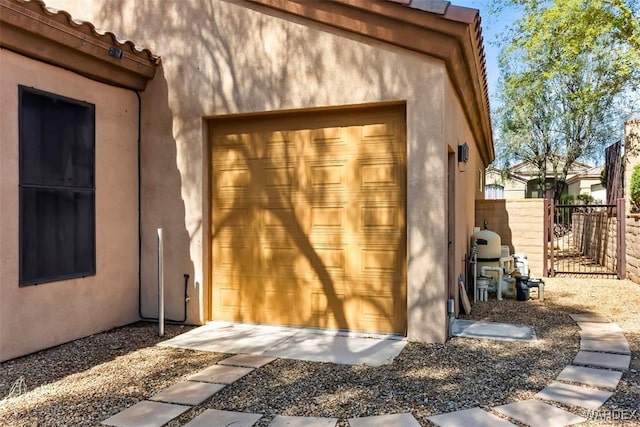 view of outdoor structure featuring fence