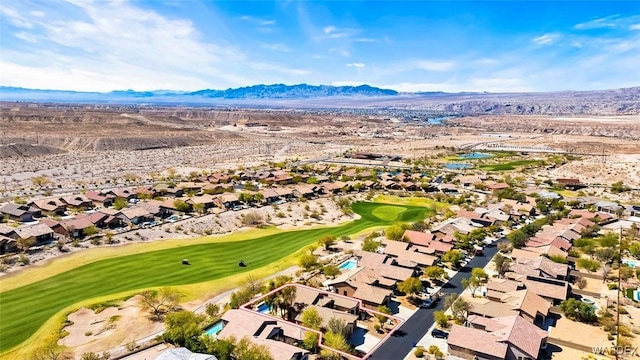 aerial view featuring a mountain view, a residential view, and view of golf course