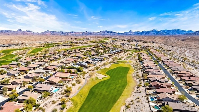 bird's eye view with view of golf course, a mountain view, and a residential view