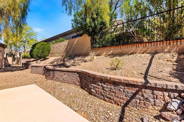 view of yard featuring a patio and fence