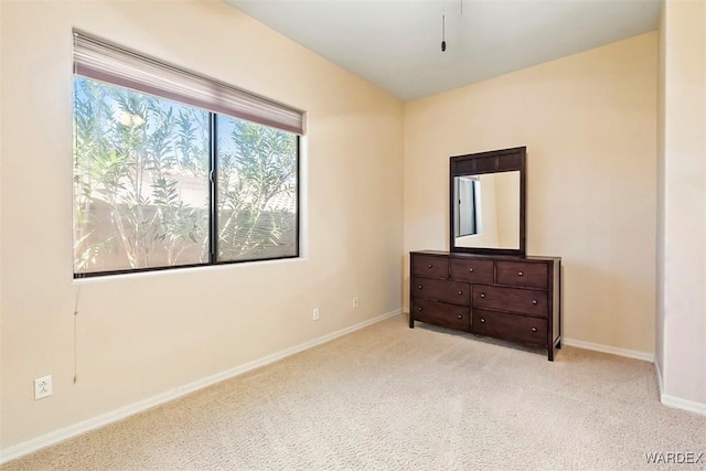 bedroom with carpet and baseboards