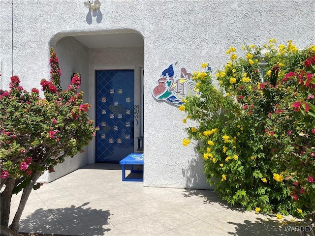 211 Columbine Dr, Lake Havasu, AZ 86403 - doorway to property featuring stucco siding