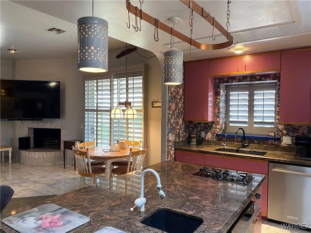 211 Columbine Dr, Lake Havasu, AZ 86403 - kitchen featuring stainless steel dishwasher, visible vents, a sink, and gas stovetop