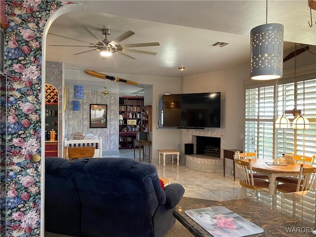 211 Columbine Dr, Lake Havasu, AZ 86403 - living area featuring visible vents, a ceiling fan, and arched walkways