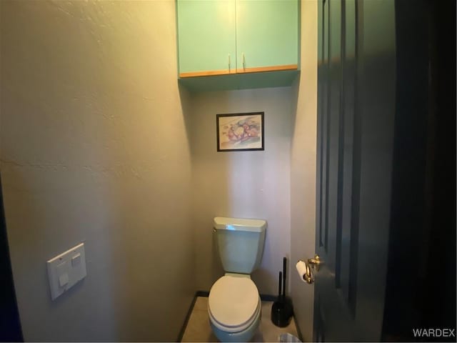 211 Columbine Dr, Lake Havasu, AZ 86403 - bathroom featuring baseboards and toilet