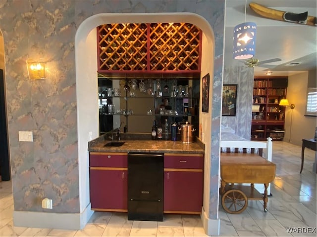211 Columbine Dr, Lake Havasu, AZ 86403 - bar featuring marble finish floor, indoor wet bar, ceiling fan, wallpapered walls, and a sink