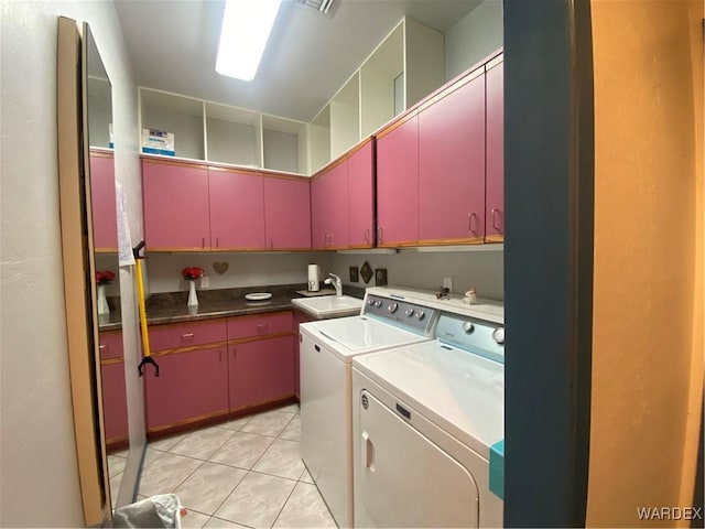211 Columbine Dr, Lake Havasu, AZ 86403 - laundry area with a sink, cabinet space, light tile patterned floors, and washer and dryer