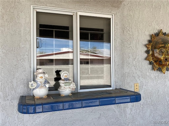 211 Columbine Dr, Lake Havasu, AZ 86403 - view of exterior entry with stucco siding