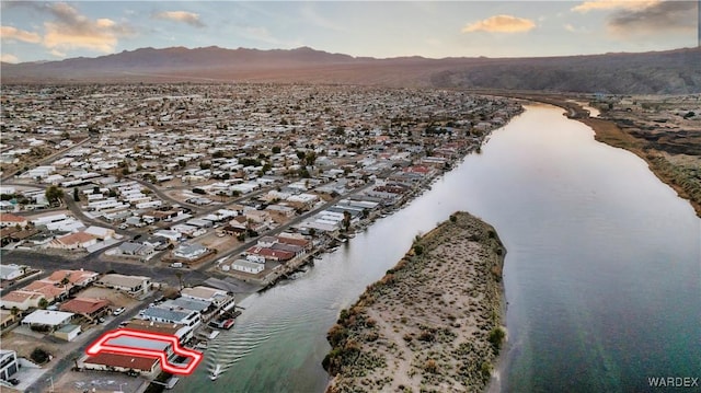 bird's eye view with a residential view and a water and mountain view