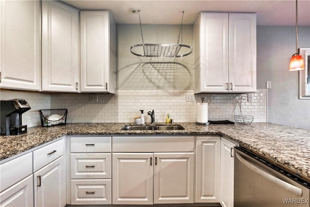 kitchen with a sink, white cabinets, stainless steel dishwasher, and hanging light fixtures