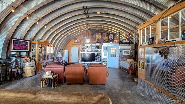 living area with vaulted ceiling