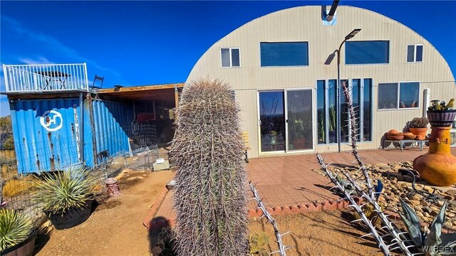 back of property featuring a patio area