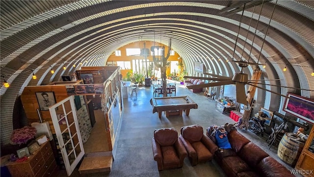 living room with lofted ceiling and billiards