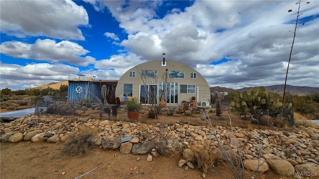 view of front of property with a mountain view