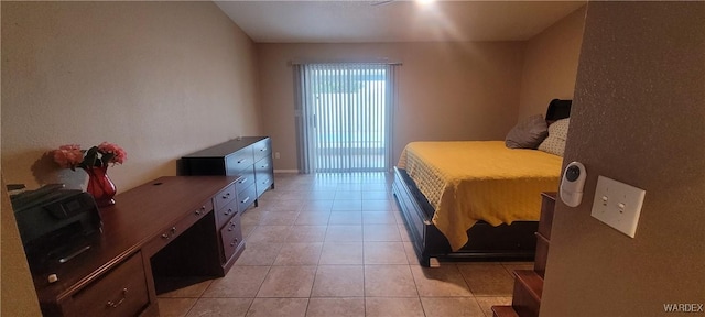 bedroom featuring light tile patterned flooring