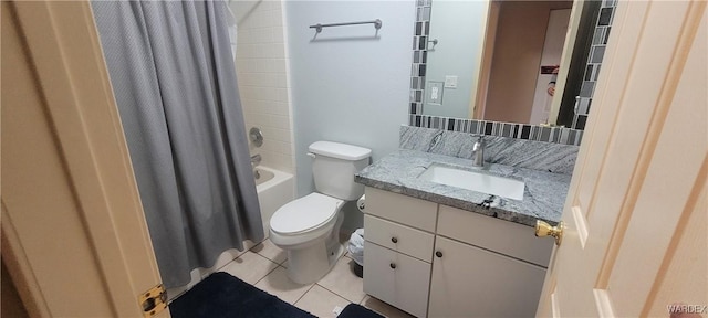 bathroom with shower / bathtub combination with curtain, toilet, vanity, and tile patterned flooring