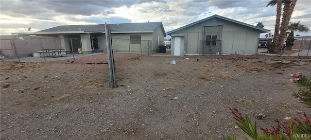 rear view of house with a patio and fence