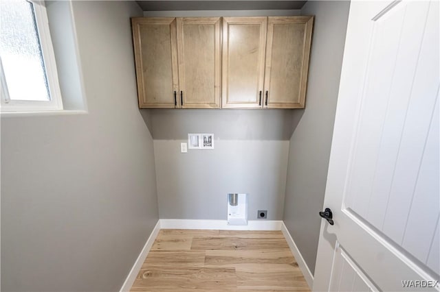 clothes washing area with washer hookup, cabinet space, light wood-style floors, electric dryer hookup, and baseboards