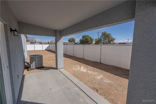 view of patio / terrace with central AC and a fenced backyard