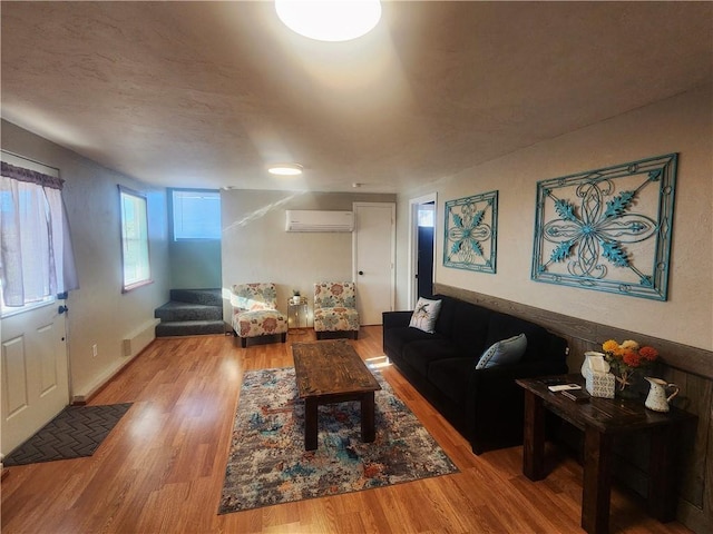 1900 W Guardian Dr, Meadview, AZ 86444 - living area featuring a wall mounted AC and wood finished floors