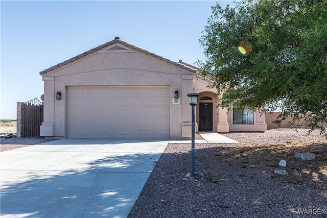 ranch-style house featuring a garage, concrete driveway, a tiled roof, and stucco siding