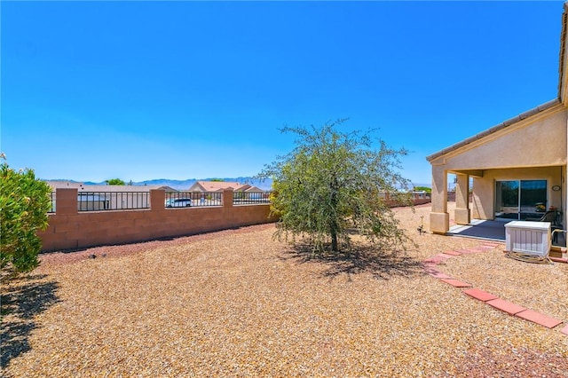 6053 S Klamath Loop, Fort Mohave, AZ 86426 - fenced backyard featuring a patio area and a mountain view