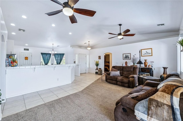 6053 S Klamath Loop, Fort Mohave, AZ 86426 - living room with light tile patterned floors, a ceiling fan, light carpet, arched walkways, and recessed lighting
