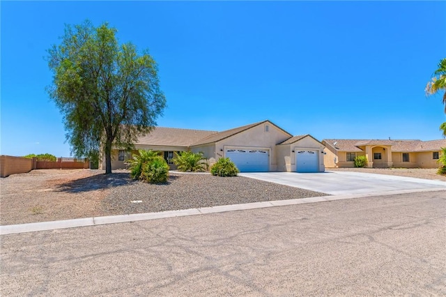 6053 S Klamath Loop, Fort Mohave, AZ 86426 - ranch-style home with an attached garage, concrete driveway, and stucco siding