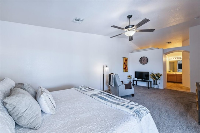 6053 S Klamath Loop, Fort Mohave, AZ 86426 - carpeted bedroom featuring arched walkways, vaulted ceiling, and a ceiling fan