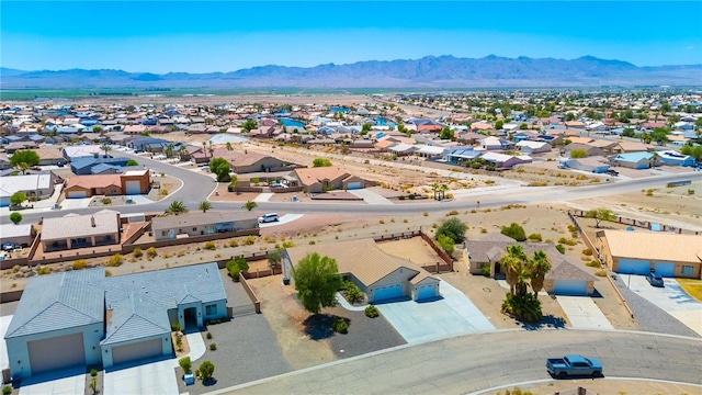 6053 S Klamath Loop, Fort Mohave, AZ 86426 - aerial perspective of suburban area featuring a mountain backdrop