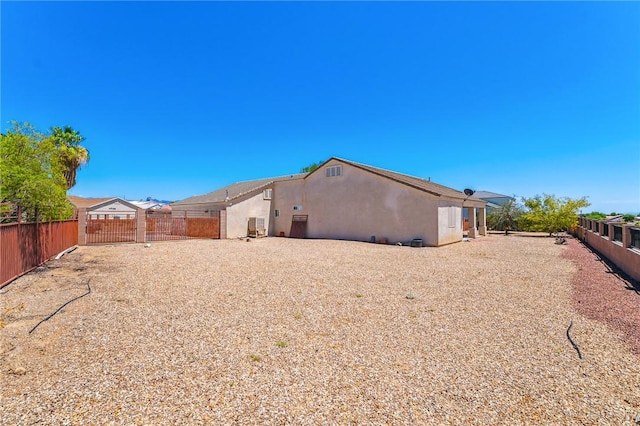 6053 S Klamath Loop, Fort Mohave, AZ 86426 - back of house featuring stucco siding and a fenced backyard