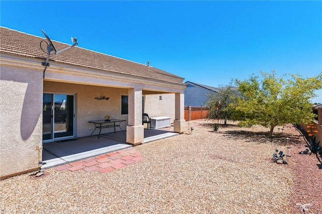 6053 S Klamath Loop, Fort Mohave, AZ 86426 - rear view of house with stucco siding and a patio area