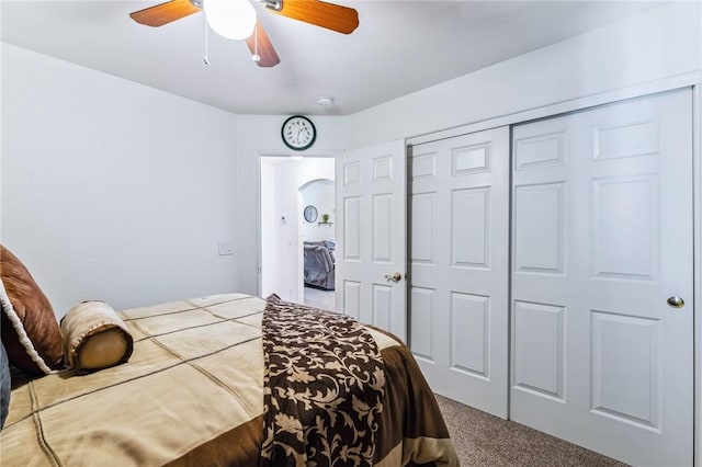 6053 S Klamath Loop, Fort Mohave, AZ 86426 - carpeted bedroom featuring a closet, a ceiling fan, and arched walkways
