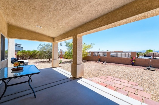 6053 S Klamath Loop, Fort Mohave, AZ 86426 - fenced backyard with a patio area