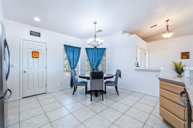 6053 S Klamath Loop, Fort Mohave, AZ 86426 - dining space with a chandelier and light tile patterned floors