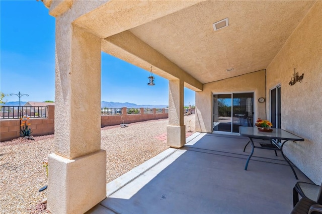 6053 S Klamath Loop, Fort Mohave, AZ 86426 - fenced backyard with a patio