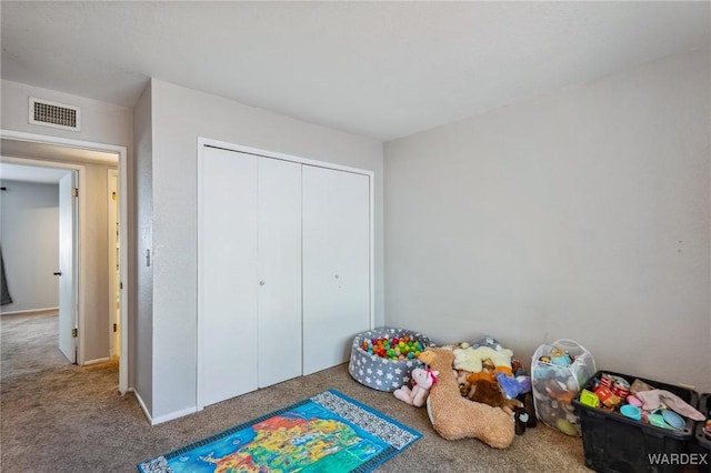 recreation room with carpet floors and visible vents