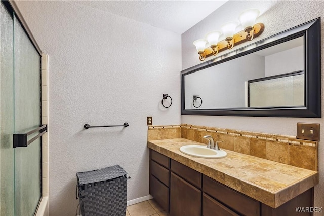 full bath with tile patterned flooring and vanity