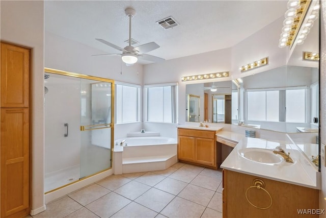 full bath with visible vents, a sink, tile patterned flooring, a shower stall, and a bath