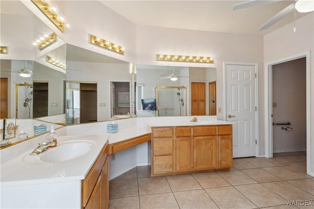 bathroom with a stall shower, tile patterned flooring, vanity, and a ceiling fan