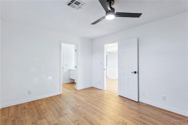 unfurnished bedroom with baseboards, visible vents, and light wood finished floors