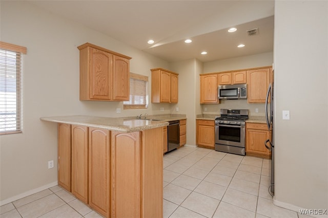 kitchen with light tile patterned floors, recessed lighting, visible vents, appliances with stainless steel finishes, and a peninsula